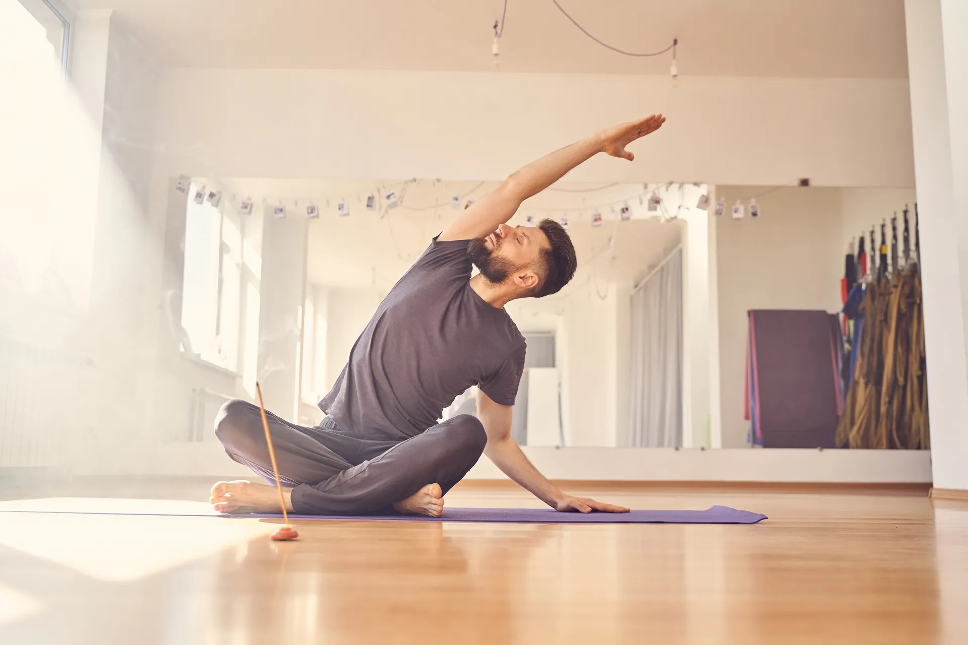 Man performing a yoga & stretch therapy exercise