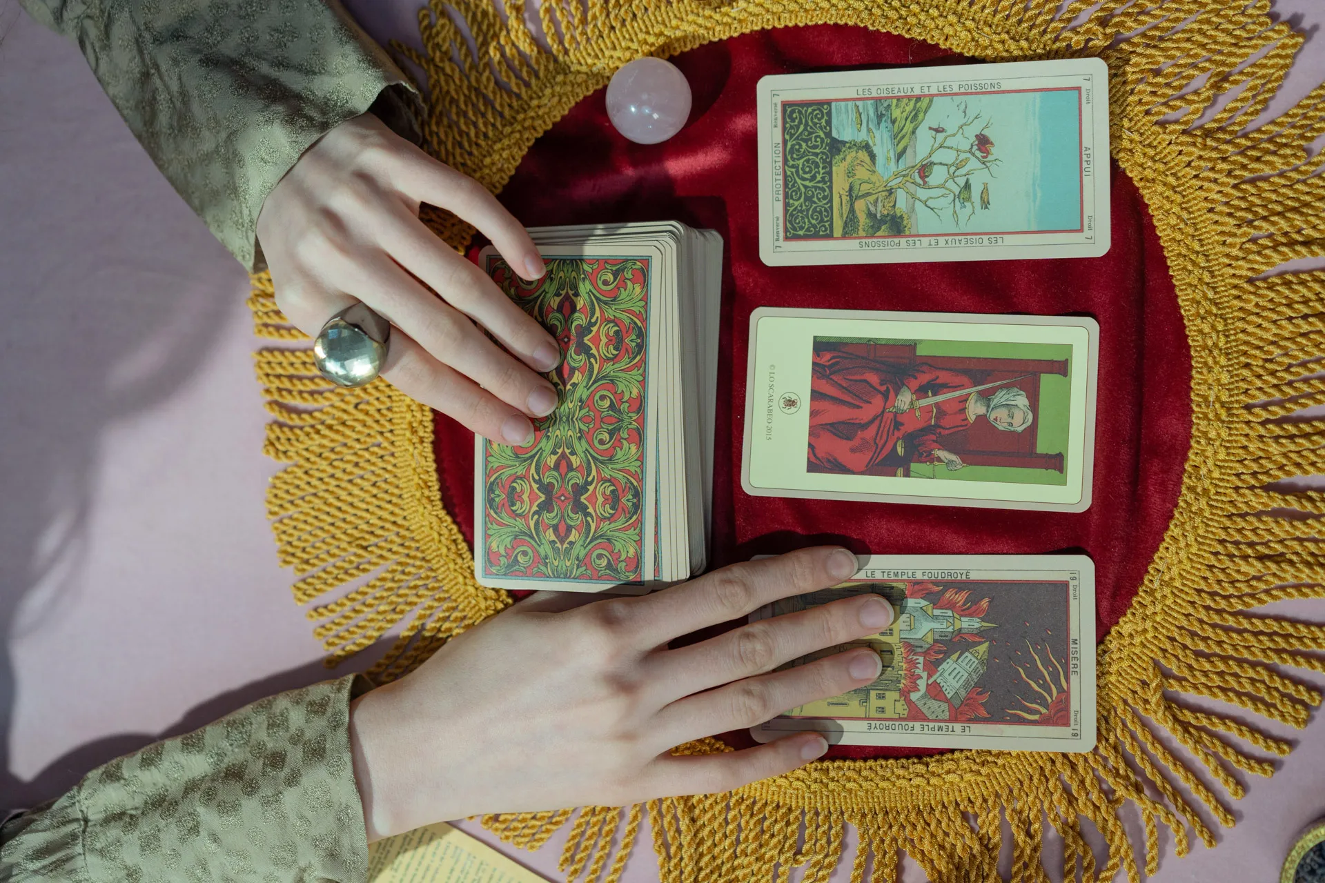 top down photo of a woman performing an intuitive tarot card reading